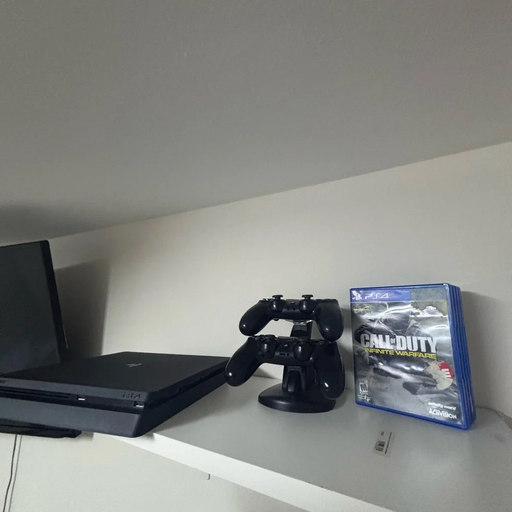 Sony PlayStation Console with DualShock Controllers - Black Like new